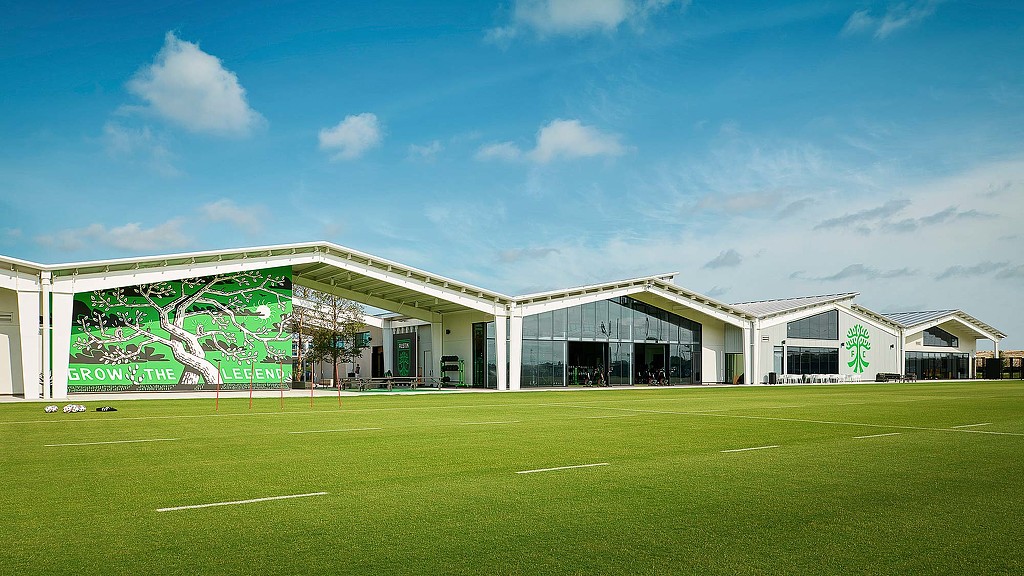 A building with a large glass front.